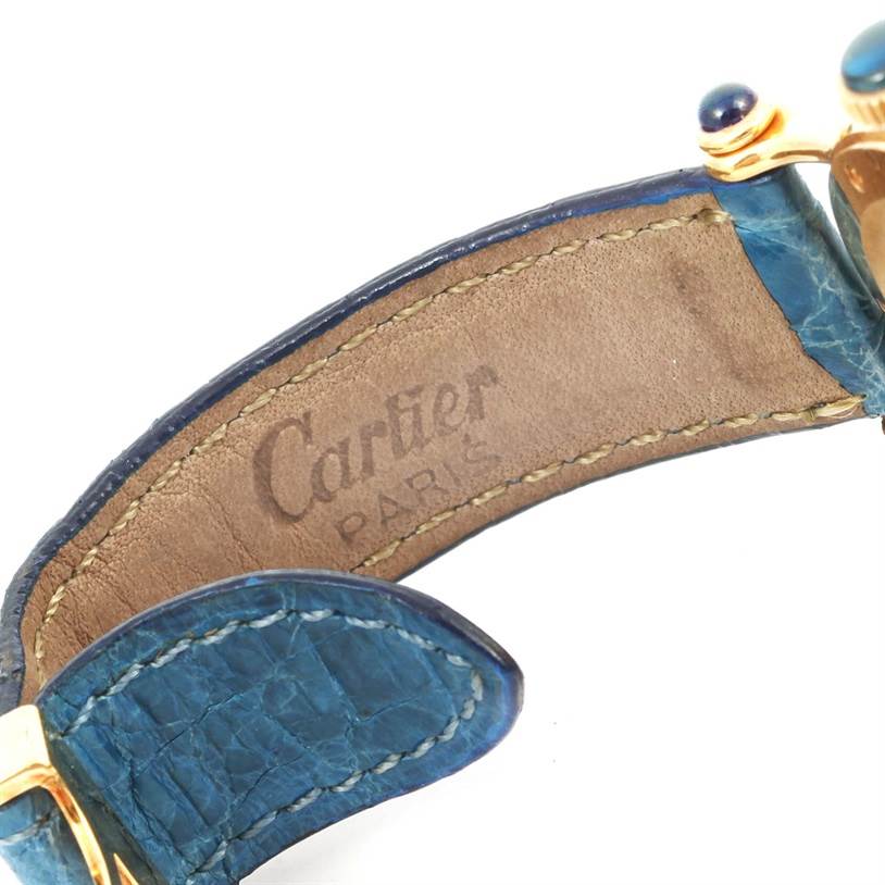 This image shows the inside of the strap of a Cartier Diabolo 1400 Women's Yellow Gold Silver Dial 1400 Women's Yellow Gold Silver Dial watch, highlighting the "Cartier Paris" imprint and blue leather band.