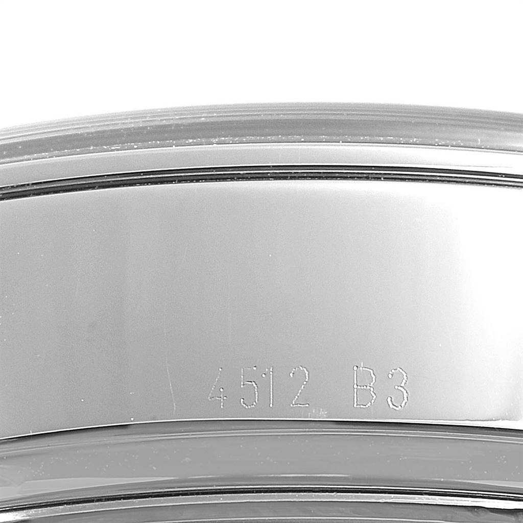 This image shows a close-up of the stainless steel bracelet of the Breitling Transocean AB0510 Men's Stainless Steel Silver Dial AB0510 Men's Stainless Steel Silver Dial watch, focusing on the engraved model number.