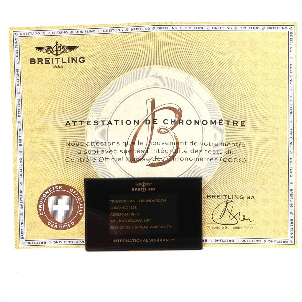 This image shows a Breitling Transocean AB0510 Men's Stainless Steel Silver Dial AB0510 Men's Stainless Steel Silver Dial model international warranty card and a certificate of chronometer (COSC) authenticity.