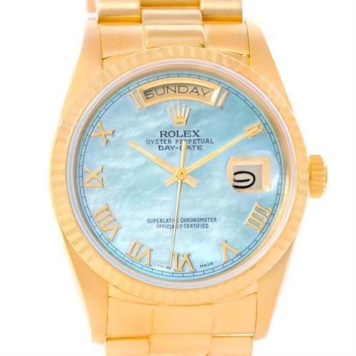 The image shows a front view of a Rolex President 18038 Men's Yellow Gold Mother of Pearl Dial 18038 Men's Yellow Gold Mother of Pearl Dial model watch, displaying its blue dial, gold Roman numerals, and day-date features.