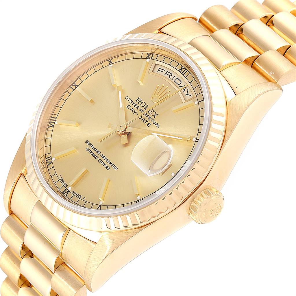 This image shows a close-up of the Rolex President 18238 Men's Yellow Gold Champagne Dial 18238 Men's Yellow Gold Champagne Dial model with a focus on the dial, crown, and part of the bracelet.