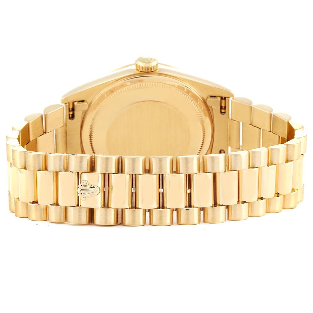 The image shows the back view of a gold Rolex President 18238 Men's Yellow Gold Champagne Dial 18238 Men's Yellow Gold Champagne Dial model watch, highlighting its bracelet and clasp.