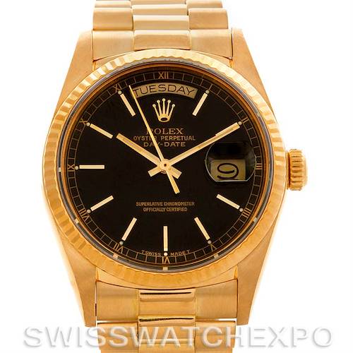 The image shows a front angle of a Rolex President 18038 Men's Yellow Gold Black Dial 18038 Men's Yellow Gold Black Dial model watch, displaying the dial, day, date, and part of the bracelet.