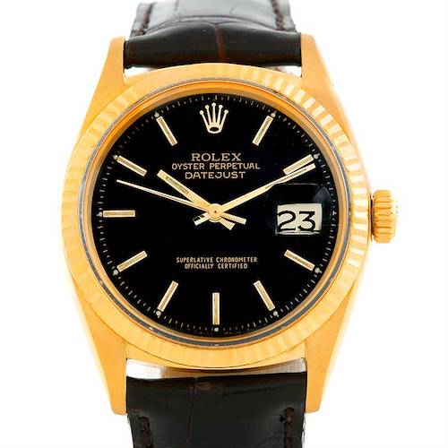 This is a frontal view of the Rolex President 1601 Men's Yellow Gold Black Dial 1601 Men's Yellow Gold Black Dial model watch, showing the dial, date window, bezel, crown, and part of the leather strap.