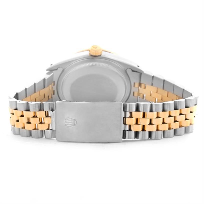 The image shows the back view of a Rolex Datejust 16233 Men's Steel and Gold (two tone) Mother of Pearl Dial 16233 Men's Steel and Gold (two tone) Mother of Pearl Dial watch, highlighting its case, crown, and two-tone bracelet with clasp.