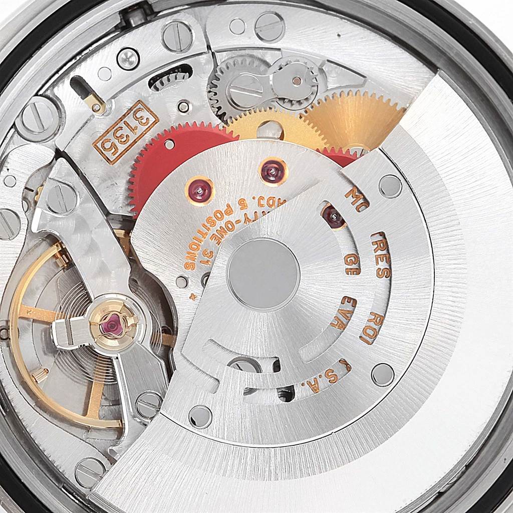 This image shows an up-close view of the mechanical movement inside a Rolex Datejust 16220 Men's Stainless Steel Silver Dial 16220 Men's Stainless Steel Silver Dial watch, highlighting its intricate gears and components.