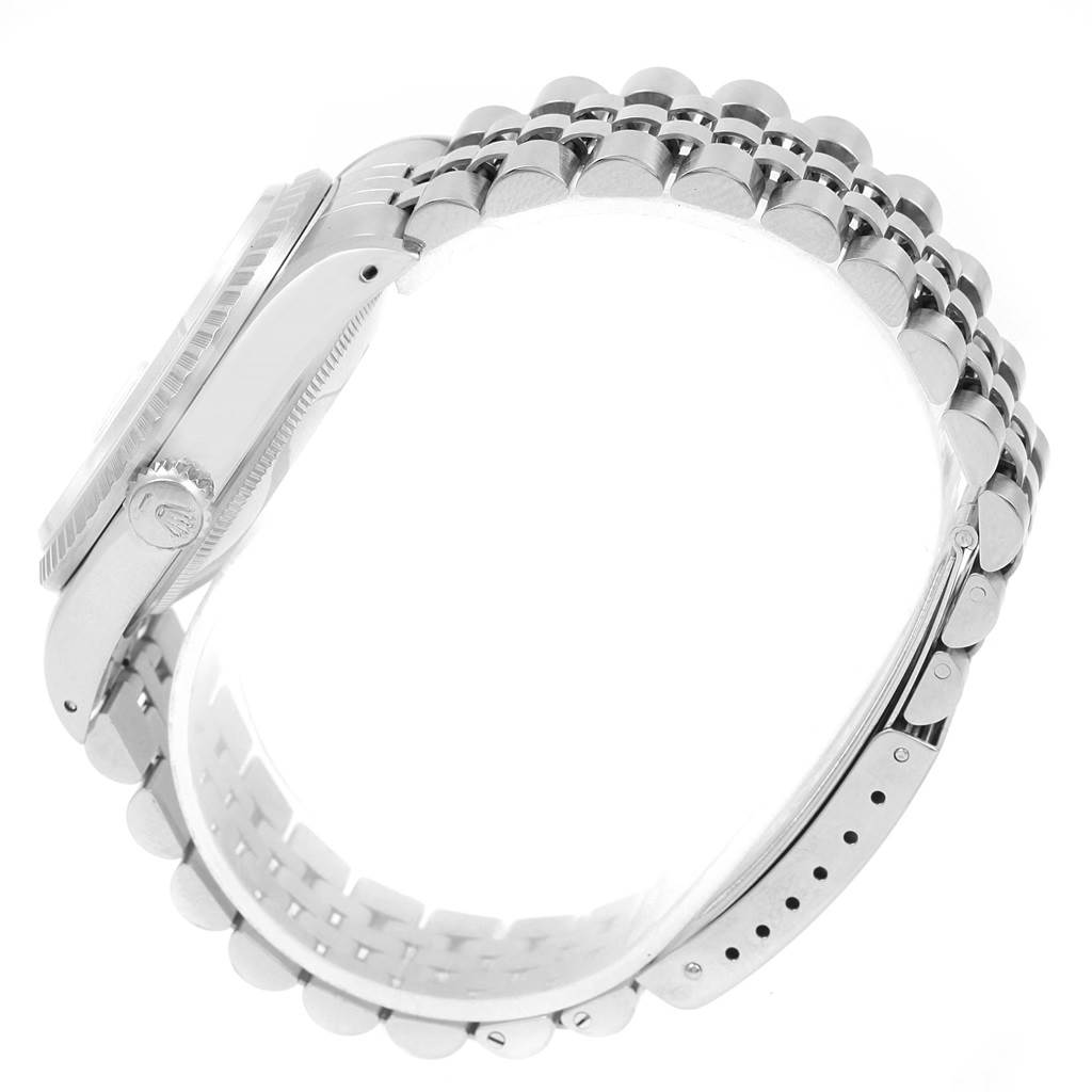 This image shows a side view of a Rolex Datejust 16220 Men's Stainless Steel Silver Dial 16220 Men's Stainless Steel Silver Dial watch, highlighting its bracelet and crown.