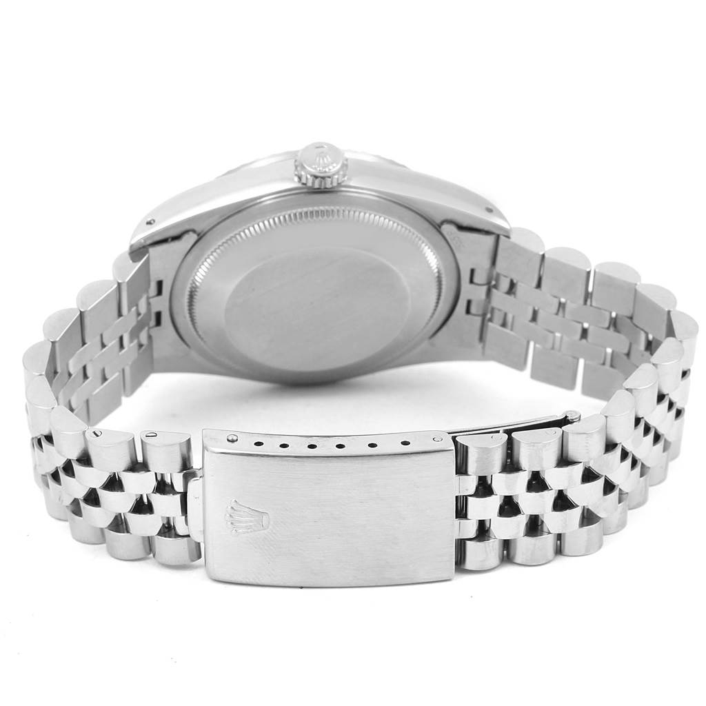 The image shows the back view of a Rolex Datejust 16220 Men's Stainless Steel Silver Dial 16220 Men's Stainless Steel Silver Dial watch, highlighting the case back and metal bracelet with a clasp.