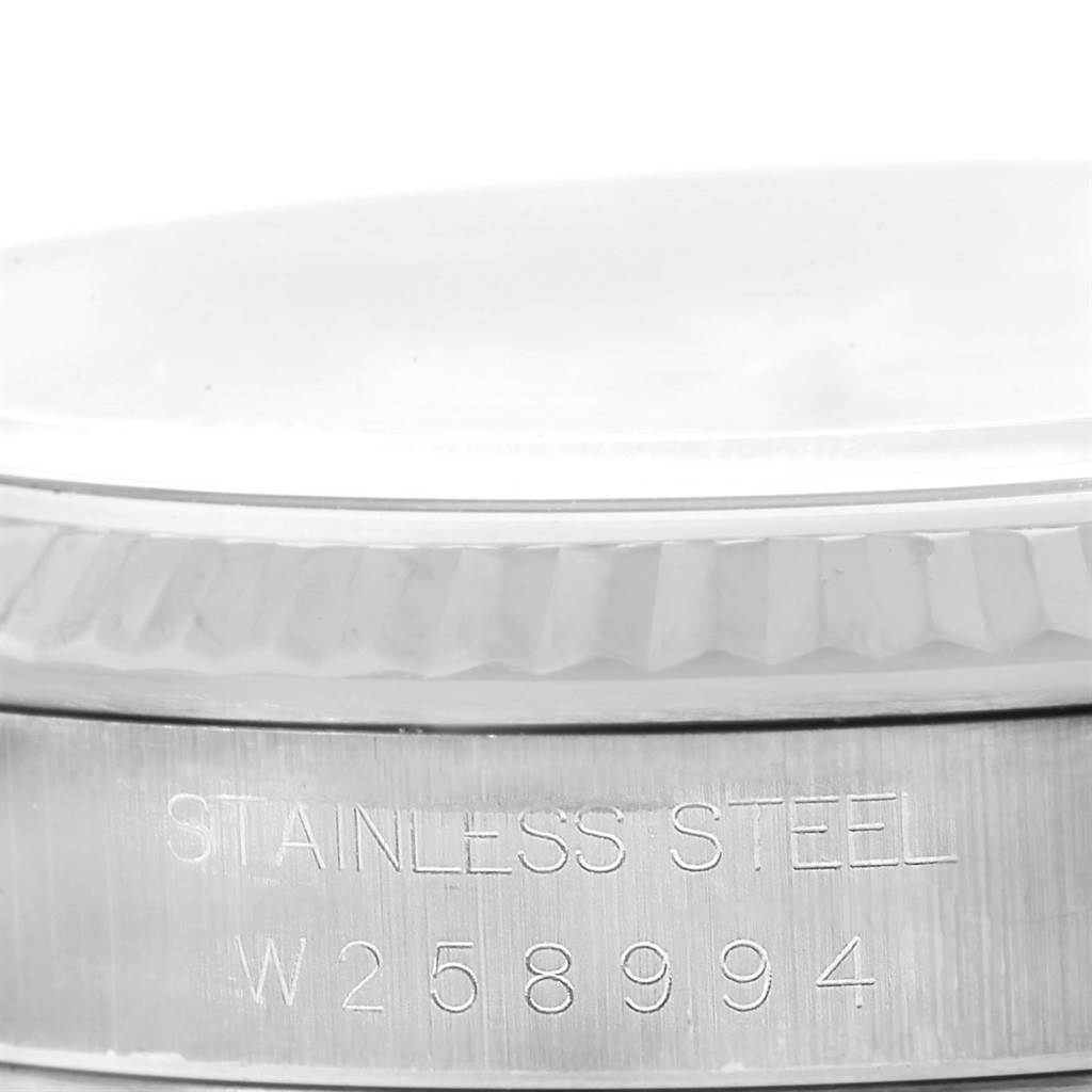 This image shows a close-up of the stainless steel casing and the serial number of a Rolex Datejust 16234 Men's Stainless Steel Beige Dial 16234 Men's Stainless Steel Beige Dial watch.