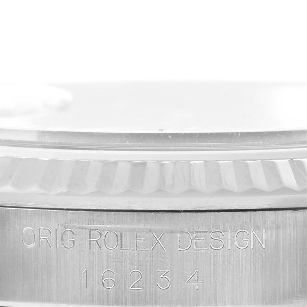 The image shows a close-up of the side of a Rolex Datejust 16234 Men's Stainless Steel Beige Dial 16234 Men's Stainless Steel Beige Dial watch, highlighting the case with the model number 16234 engraved.