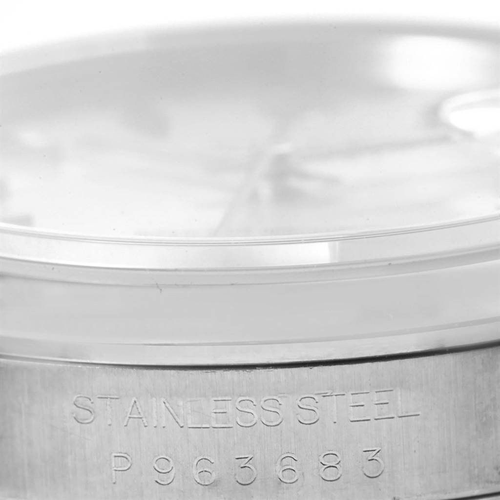 This image shows a close-up of the side of a Rolex Datejust 16200 Men's Stainless Steel Silver Dial 16200 Men's Stainless Steel Silver Dial watch, highlighting the stainless steel case and its serial number.