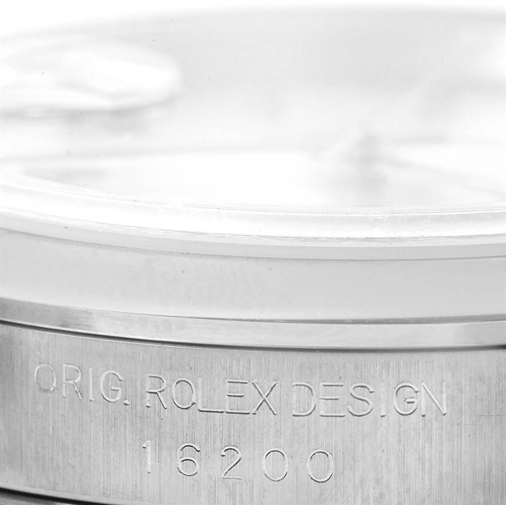 The image shows a close-up of the side of a Rolex Datejust 16200 Men's Stainless Steel Silver Dial 16200 Men's Stainless Steel Silver Dial watch case, displaying the model number and "Orig. Rolex Design" engraving.