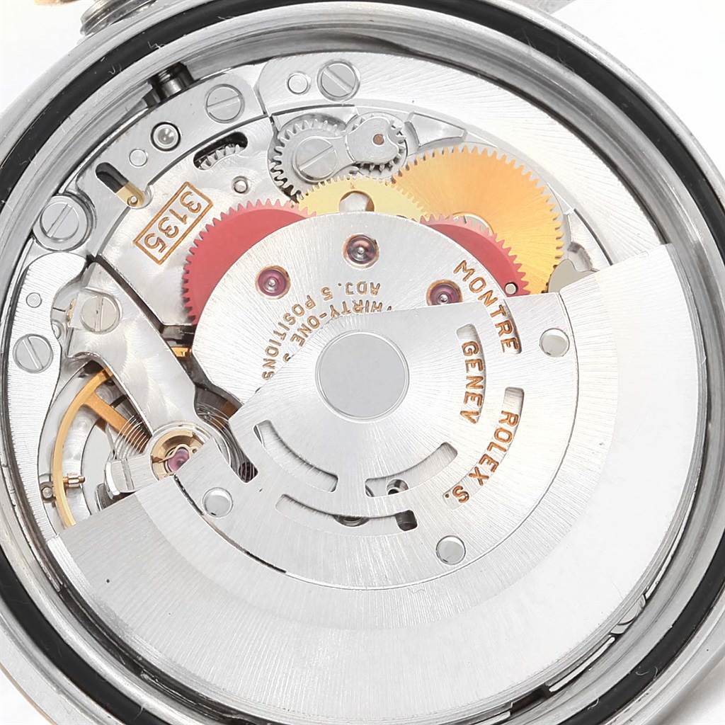 The image shows the intricate internal mechanism of a Rolex Datejust 16233 Men's Steel and Gold (two tone) Blue Dial 16233 Men's Steel and Gold (two tone) Blue Dial watch from a back view angle.