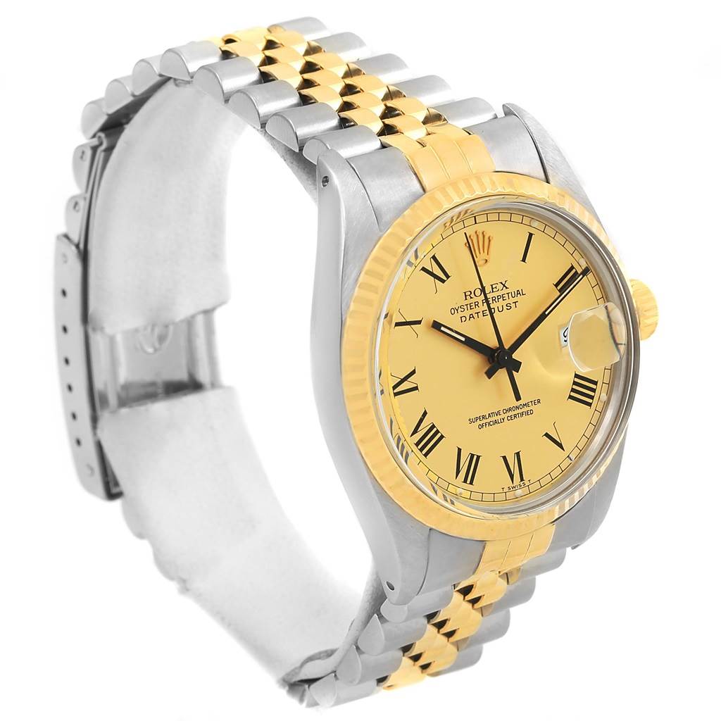 The image shows a side angle of a Rolex Datejust 16013 Men's Stainless Steel Champagne Dial 16013 Men's Stainless Steel Champagne Dial watch, featuring a yellow dial, two-tone bracelet, and fluted bezel.