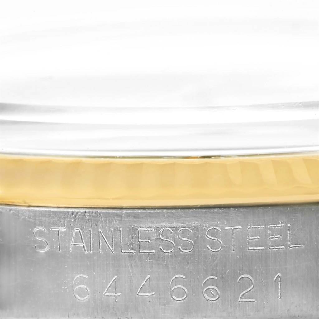 The image shows the side profile of a Rolex Datejust 16013 Men's Stainless Steel Champagne Dial 16013 Men's Stainless Steel Champagne Dial watch with the engraved text "STAINLESS STEEL" and a partial serial number visible.