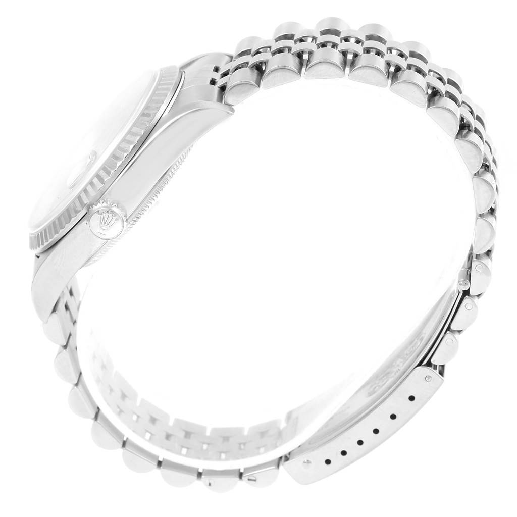 The image shows a side view of a Rolex Datejust 16234 Men's Stainless Steel Blue Dial 16234 Men's Stainless Steel Blue Dial watch, highlighting the case, crown, and Jubilee bracelet.