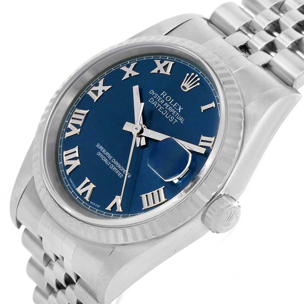 The image shows a Rolex Datejust 16234 Men's Stainless Steel Blue Dial 16234 Men's Stainless Steel Blue Dial watch at a slight angle, highlighting its blue dial, Roman numerals, fluted bezel, crown, and Jubilee bracelet.