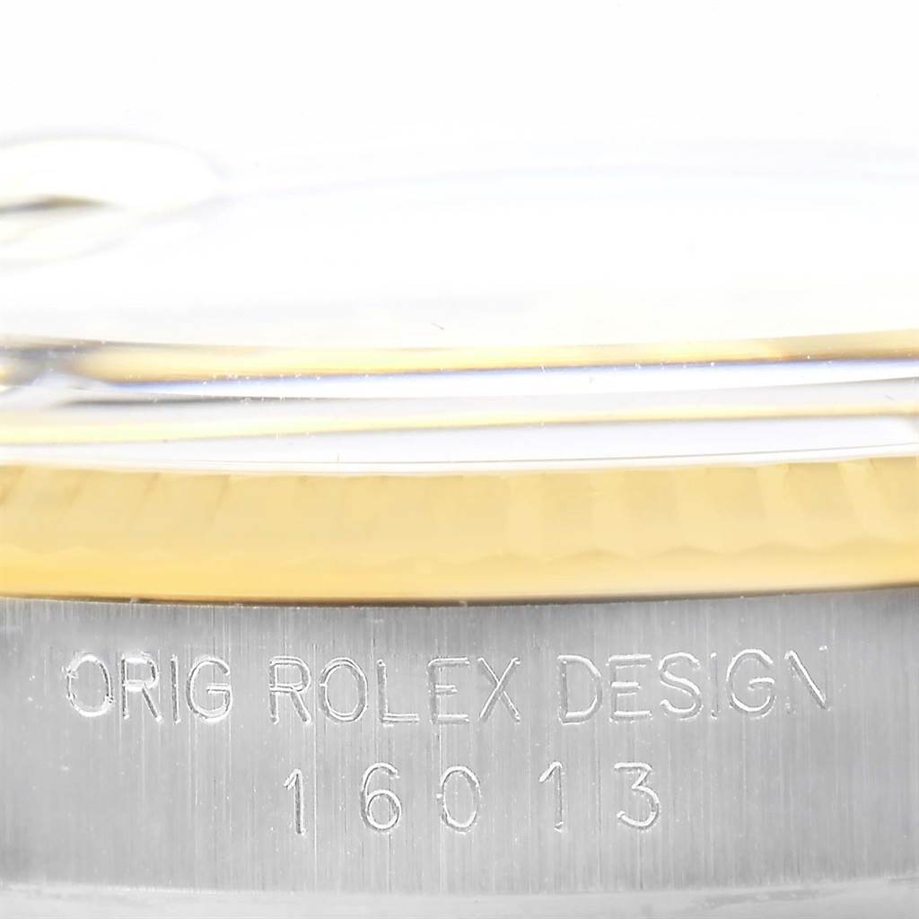This close-up image shows the case side of the Rolex Datejust 16013 Men's Stainless Steel Champagne Dial 16013 Men's Stainless Steel Champagne Dial, highlighting the engraved model number 16013.