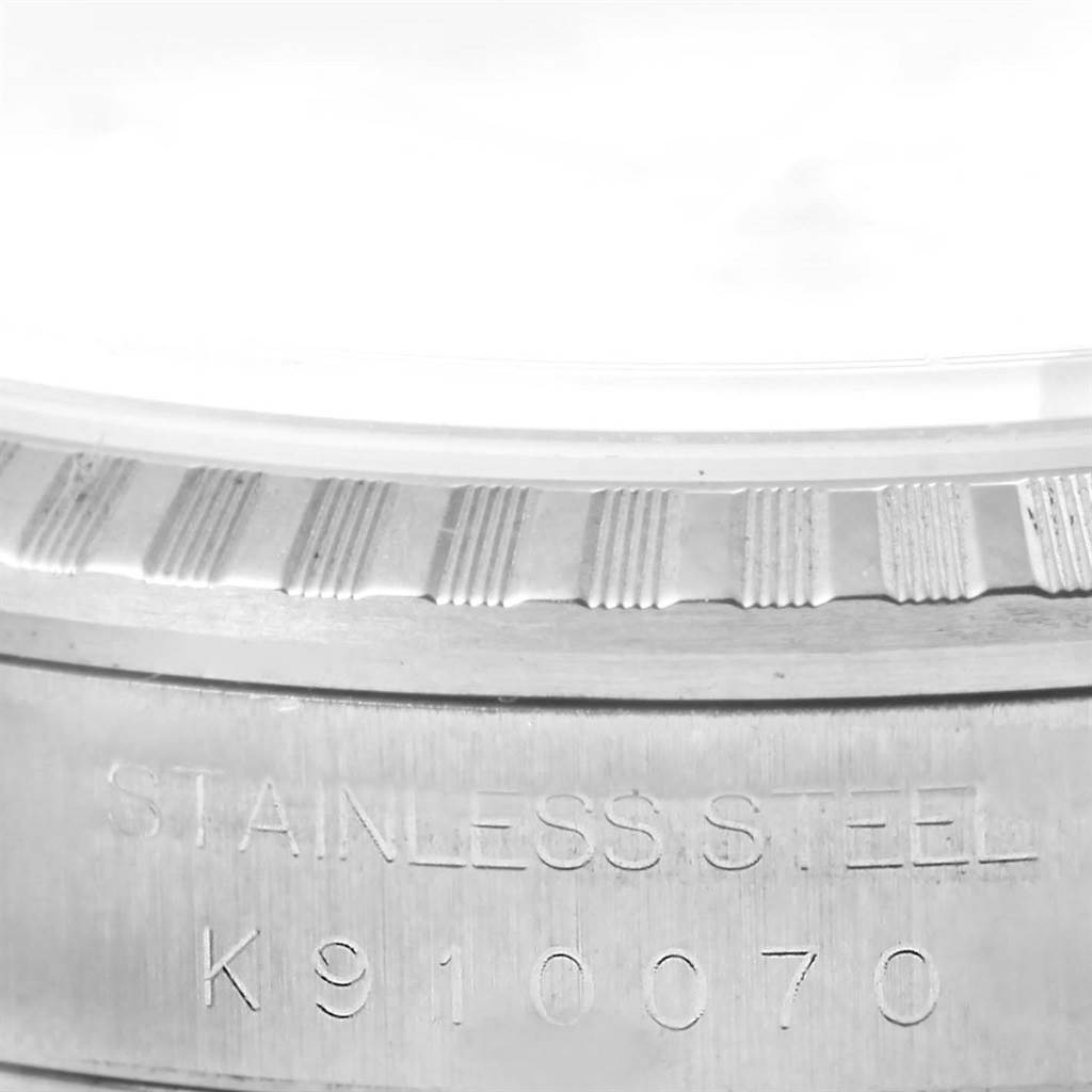 The image shows a close-up of the side case and engraved serial number of a Rolex Datejust 16220 Men's Stainless Steel White Dial 16220 Men's Stainless Steel White Dial watch.