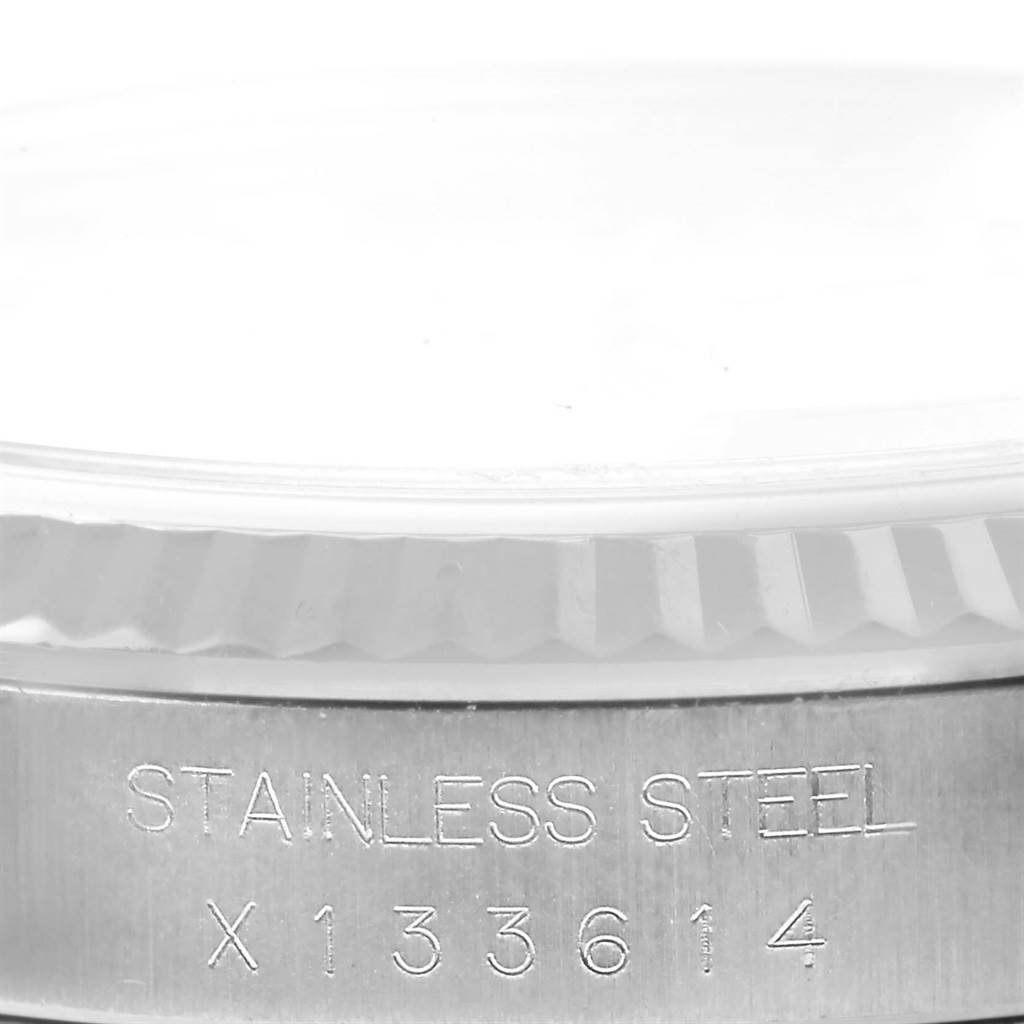 This close-up image of the Rolex Datejust 16234 Stainless Steel Silver Dial 16234 Stainless Steel Silver Dial watch shows the stainless steel case back with a partial view of the fluted bezel.