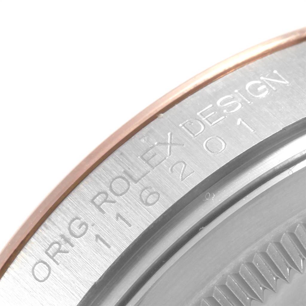 This close-up shows the bezel engravings of a Rolex Datejust 116201 Men's Steel and Gold (two tone) Black Dial 116201 Men's Steel and Gold (two tone) Black Dial watch, highlighting part of the model number and "ORIG ROLEX DESIGN."