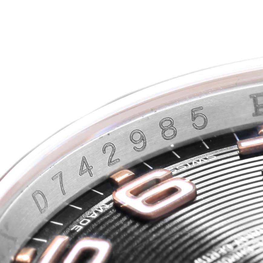 Close-up angle of the Rolex Datejust 116201 Men's Steel and Gold (two tone) Black Dial 116201 Men's Steel and Gold (two tone) Black Dial model showing the watch's serial number and part of the dial with numerals.