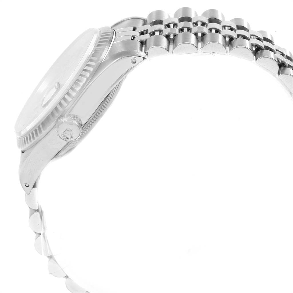 The image shows a side view of the Rolex Datejust 16234 Men's Stainless Steel Silver Dial 16234 Men's Stainless Steel Silver Dial watch, including the crown, case, and part of the bracelet.