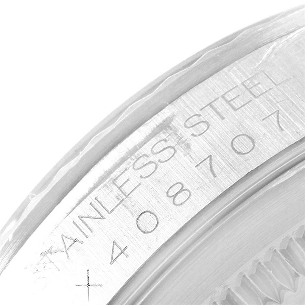 The image shows a close-up angle of the case back with serial number engraving on a Rolex Datejust 16234 Men's Stainless Steel Silver Dial 16234 Men's Stainless Steel Silver Dial watch.