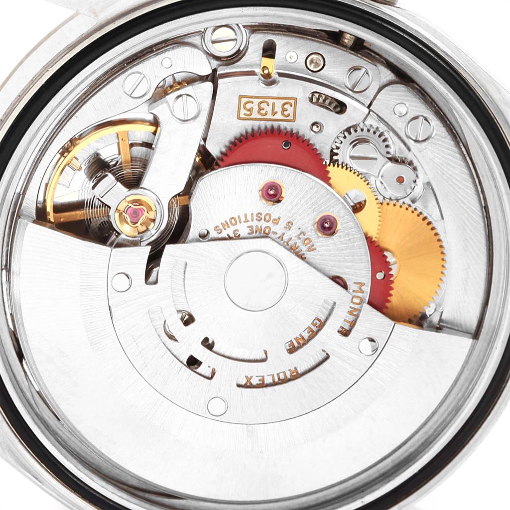 This close-up image shows the intricate internal movement of a Rolex Datejust 16234 Men's Stainless Steel Silver Dial 16234 Men's Stainless Steel Silver Dial watch, highlighting its gears and mechanical components.