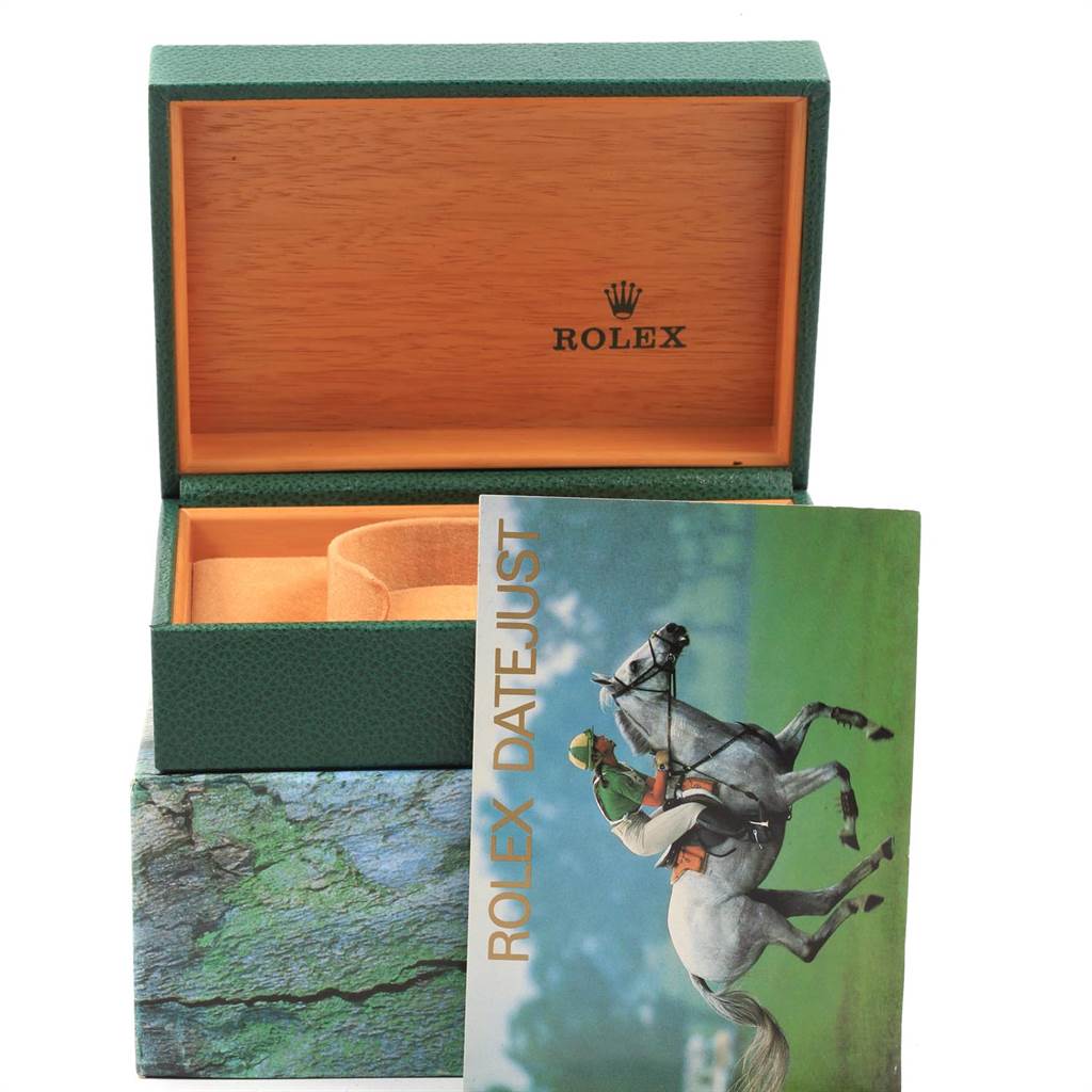 This image shows an open Rolex Datejust 16233 Men's Steel and Gold (two tone) Beige Dial 16233 Men's Steel and Gold (two tone) Beige Dial box with a booklet in front of it.