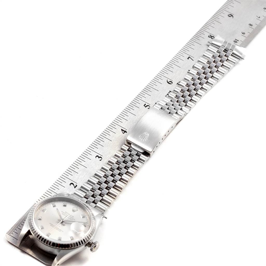 The image shows a flat-lay view of a Rolex Datejust 16234 Men's Stainless Steel Silver Dial 16234 Men's Stainless Steel Silver Dial watch, including the face, bracelet, and clasp, measured against a ruler.