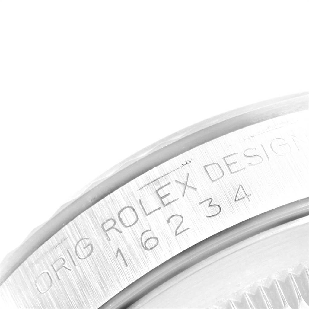 Close-up of the case side of a Rolex Datejust 16234 Men's Stainless Steel Silver Dial 16234 Men's Stainless Steel Silver Dial, showing the model number and "Orig Rolex Design" engraving.