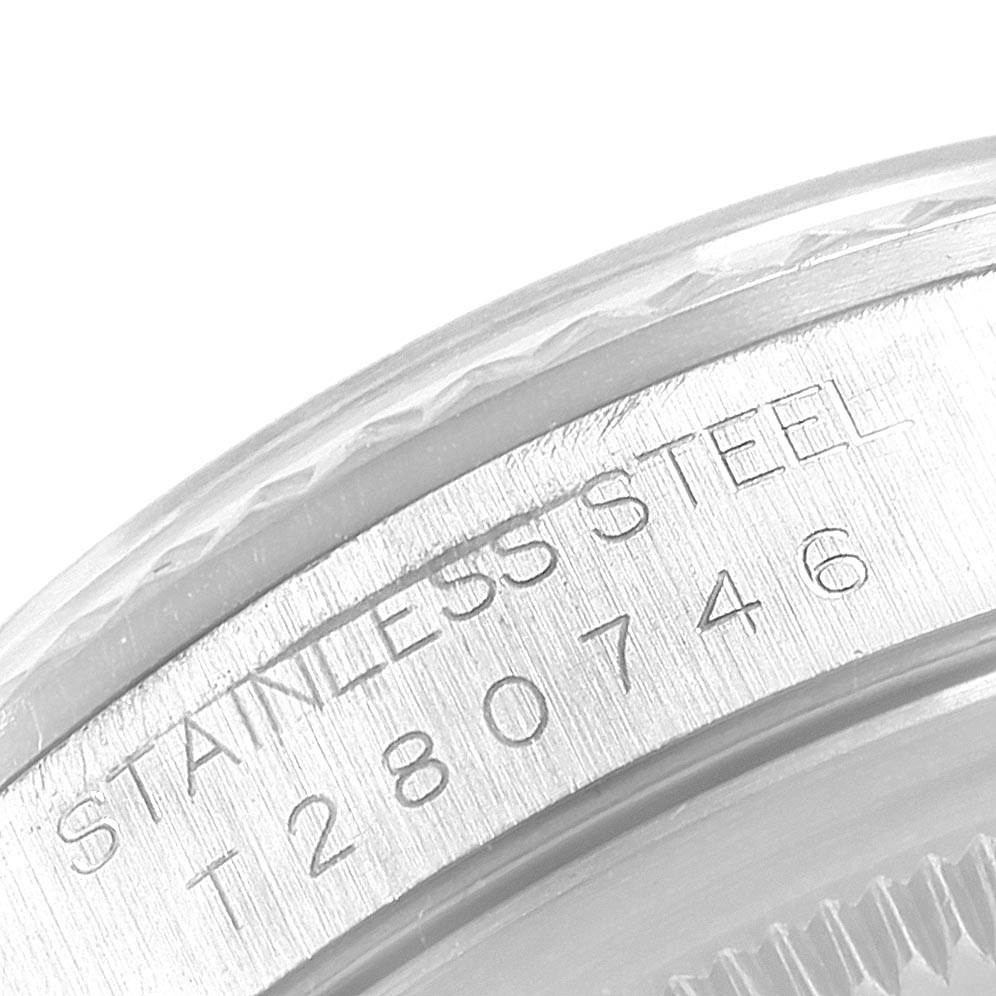 The image shows a close-up of the serial number and "STAINLESS STEEL" engraving on a Rolex Datejust 16234 Men's Stainless Steel Silver Dial 16234 Men's Stainless Steel Silver Dial watch.