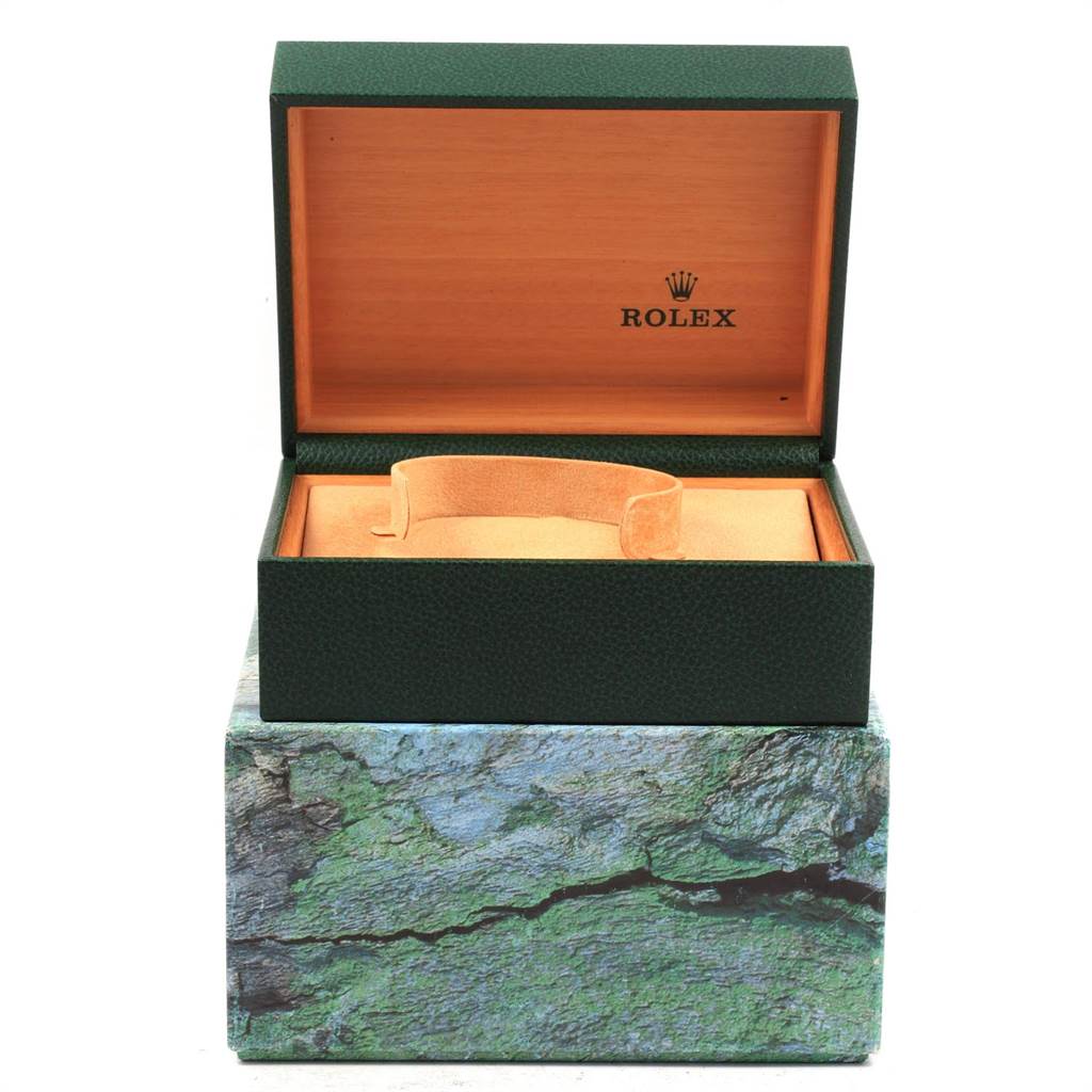 This image shows an open green Rolex Datejust 16234 Men's Stainless Steel Silver Dial 16234 Men's Stainless Steel Silver Dial watch box with no watch inside, displaying the interior and cushioning.