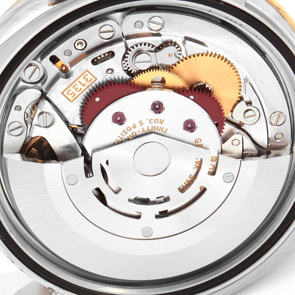 This image shows the internal mechanism and movement components of a Rolex Datejust 116243 Women's Steel and Gold (two tone) Brown Dial 116243 Women's Steel and Gold (two tone) Brown Dial watch.