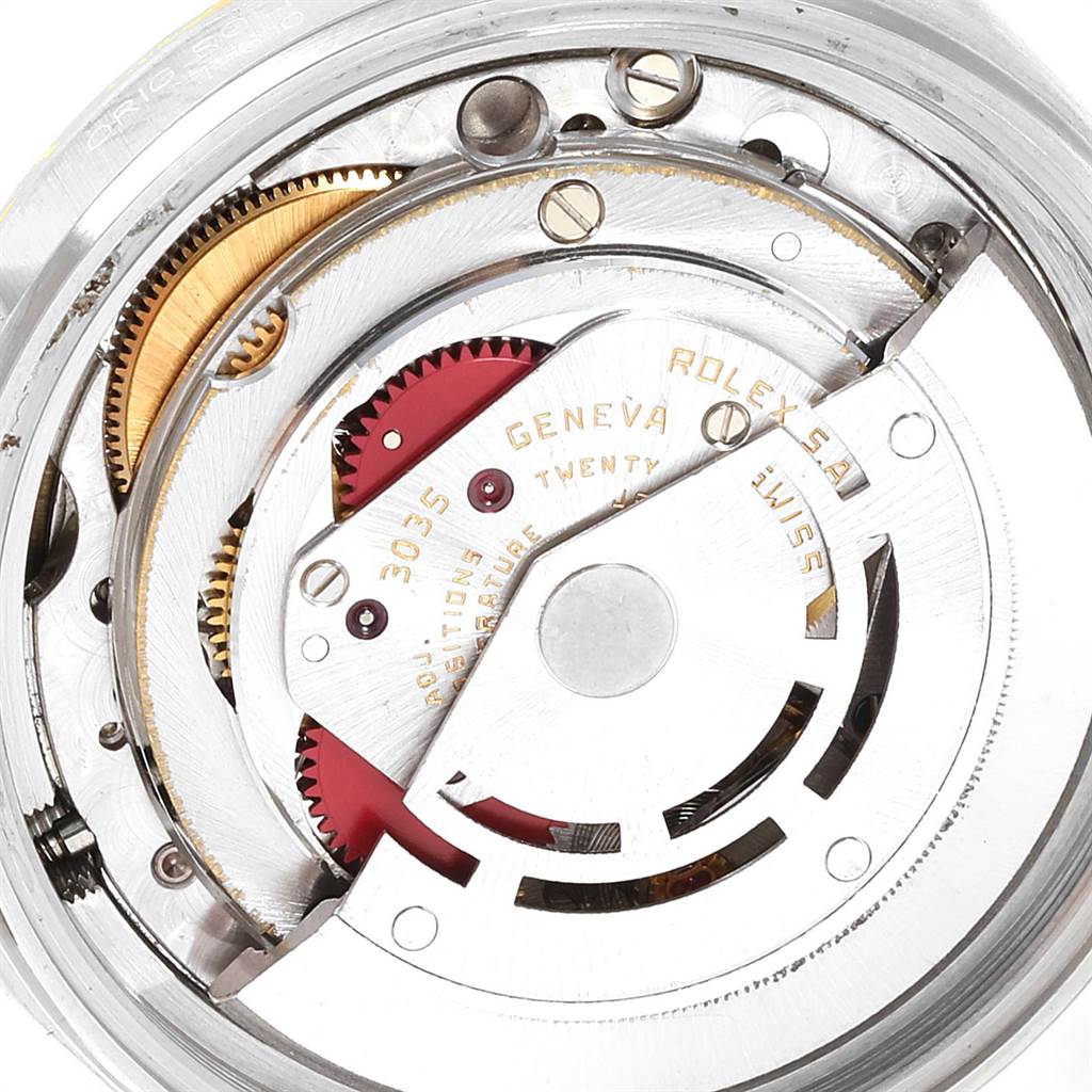 The image shows a close-up of the movement mechanism of a Rolex Datejust 16013 Men's Steel and Gold (two tone) Champagne Dial 16013 Men's Steel and Gold (two tone) Champagne Dial watch, focusing on its internal components and gears.