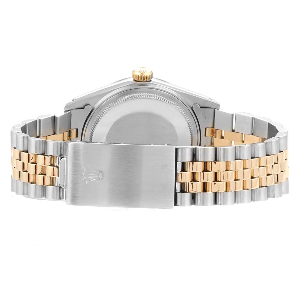 This image shows the back and bracelet of a Rolex Datejust 16013 Men's Steel and Gold (two tone) Champagne Dial 16013 Men's Steel and Gold (two tone) Champagne Dial watch, highlighting the clasp and two-tone metal design.