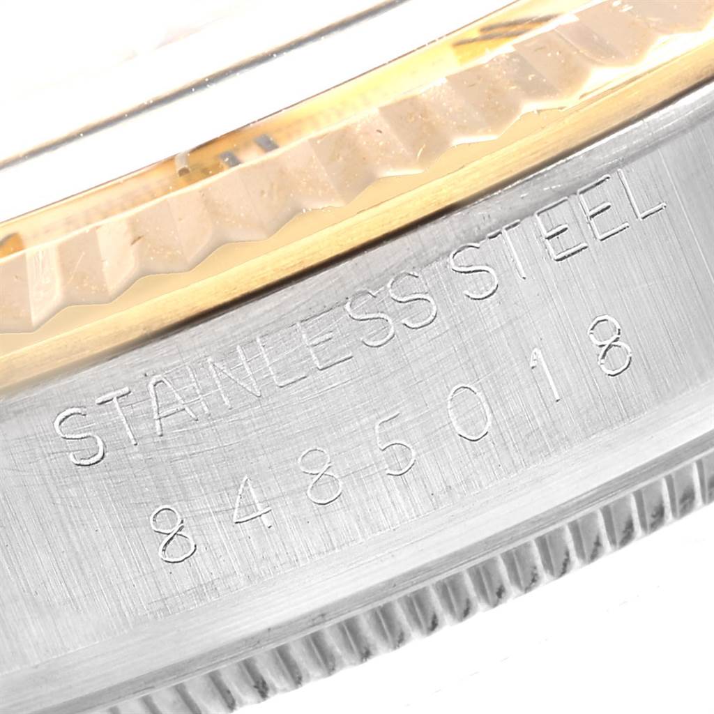 The image shows a close-up of the stainless steel casing and fluted bezel edge of a Rolex Datejust 16013 Men's Steel and Gold (two tone) Champagne Dial 16013 Men's Steel and Gold (two tone) Champagne Dial watch, with part of the serial number visible.