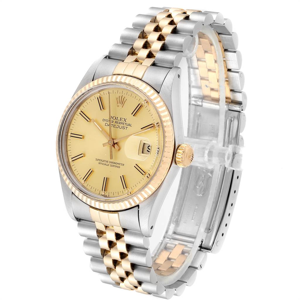 This image shows a Rolex Datejust 16013 Men's Steel and Gold (two tone) Champagne Dial 16013 Men's Steel and Gold (two tone) Champagne Dial watch from the front angle, highlighting its gold and silver bracelet, dial, and fluted bezel.
