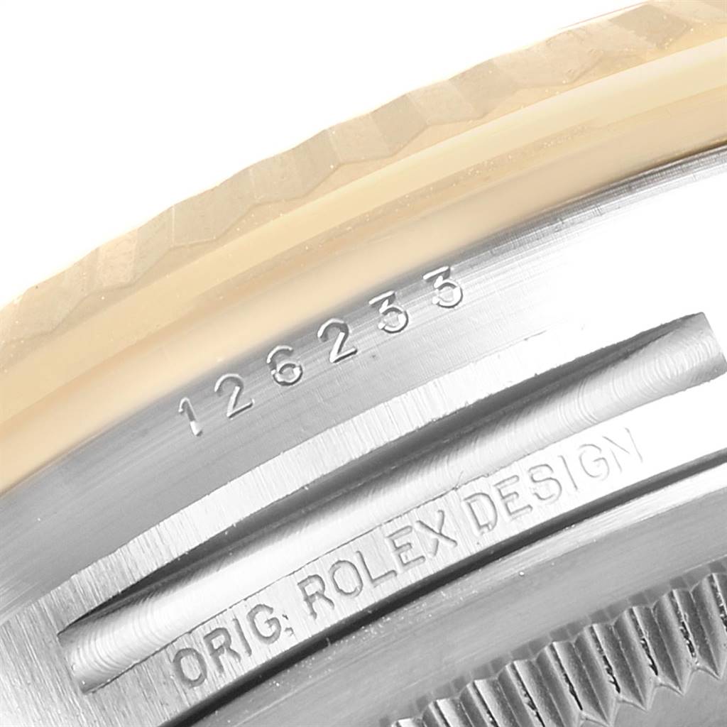 This image shows a close-up of the side of the Rolex Datejust 126233 Men's Steel and Gold (two tone) White Dial 126233 Men's Steel and Gold (two tone) White Dial watch, revealing its model number and the “Orig. Rolex Design” engraving.
