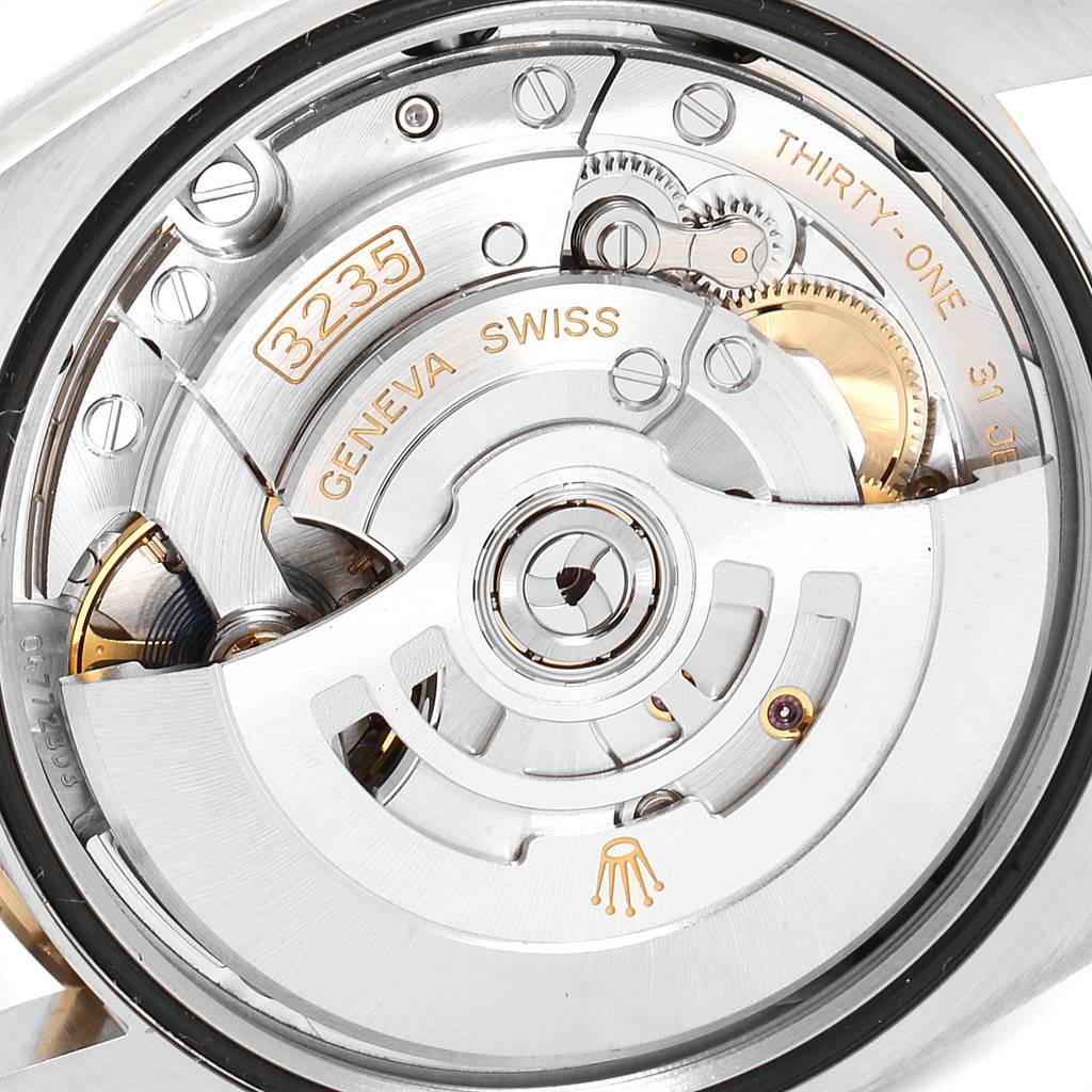 This image shows the movement and inner workings of a Rolex Datejust 126233 Men's Steel and Gold (two tone) White Dial 126233 Men's Steel and Gold (two tone) White Dial watch from a back angle.