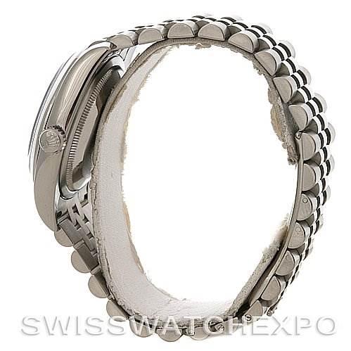 This image shows a side view of a Rolex Datejust 116200-BKRJ Men's Stainless Steel Black Dial 116200-BKRJ Men's Stainless Steel Black Dial model, focusing on the bezel, part of the bracelet, and the crown.