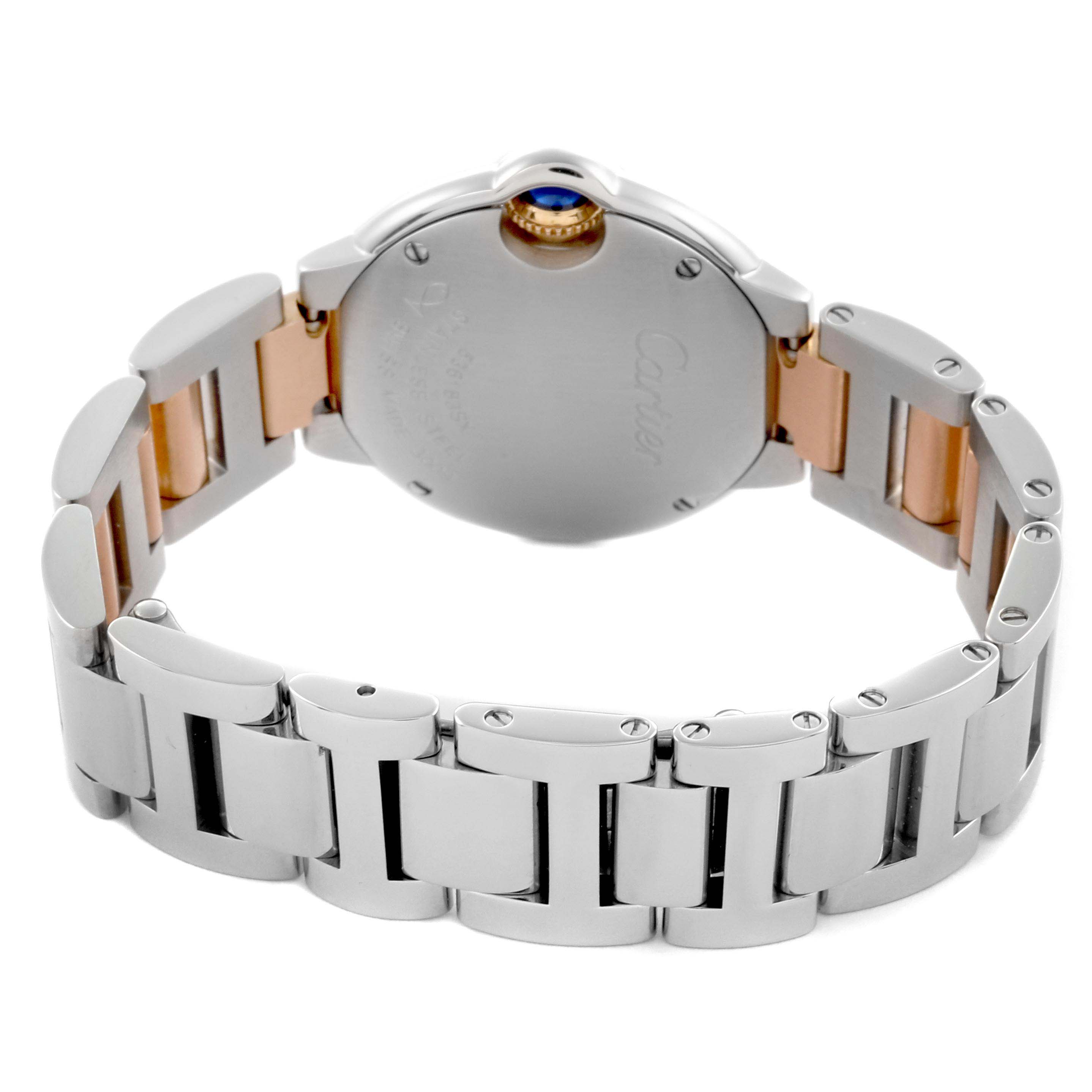 The image shows the back view of a Cartier Ballon Bleu WE902030 Women's Steel and Gold (two tone) Silver Dial WE902030 Women's Steel and Gold (two tone) Silver Dial watch, highlighting its metal bracelet and case back.