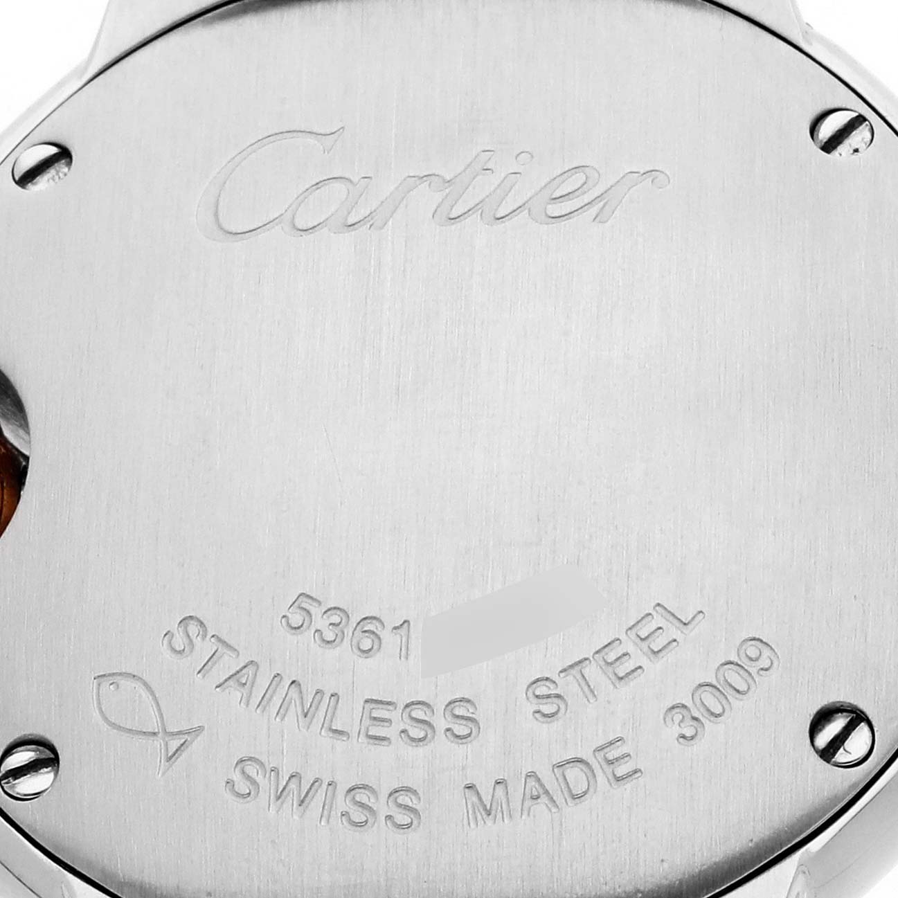The image shows the back case of the Ballon Bleu by Cartier, featuring engraved details and screws.