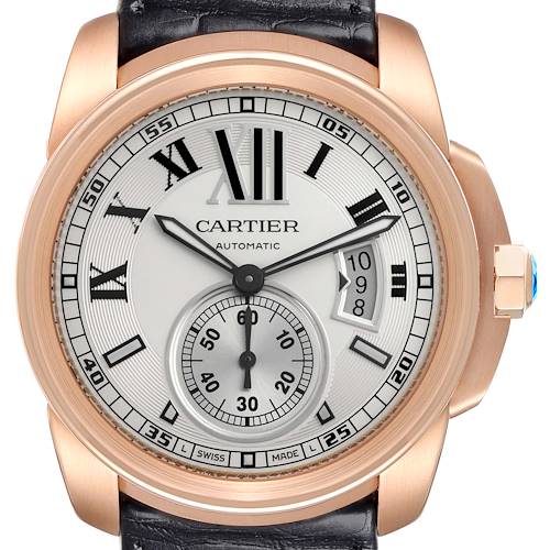 The Calibre de Cartier watch is shown from the front, highlighting the dial, case, and bezel.