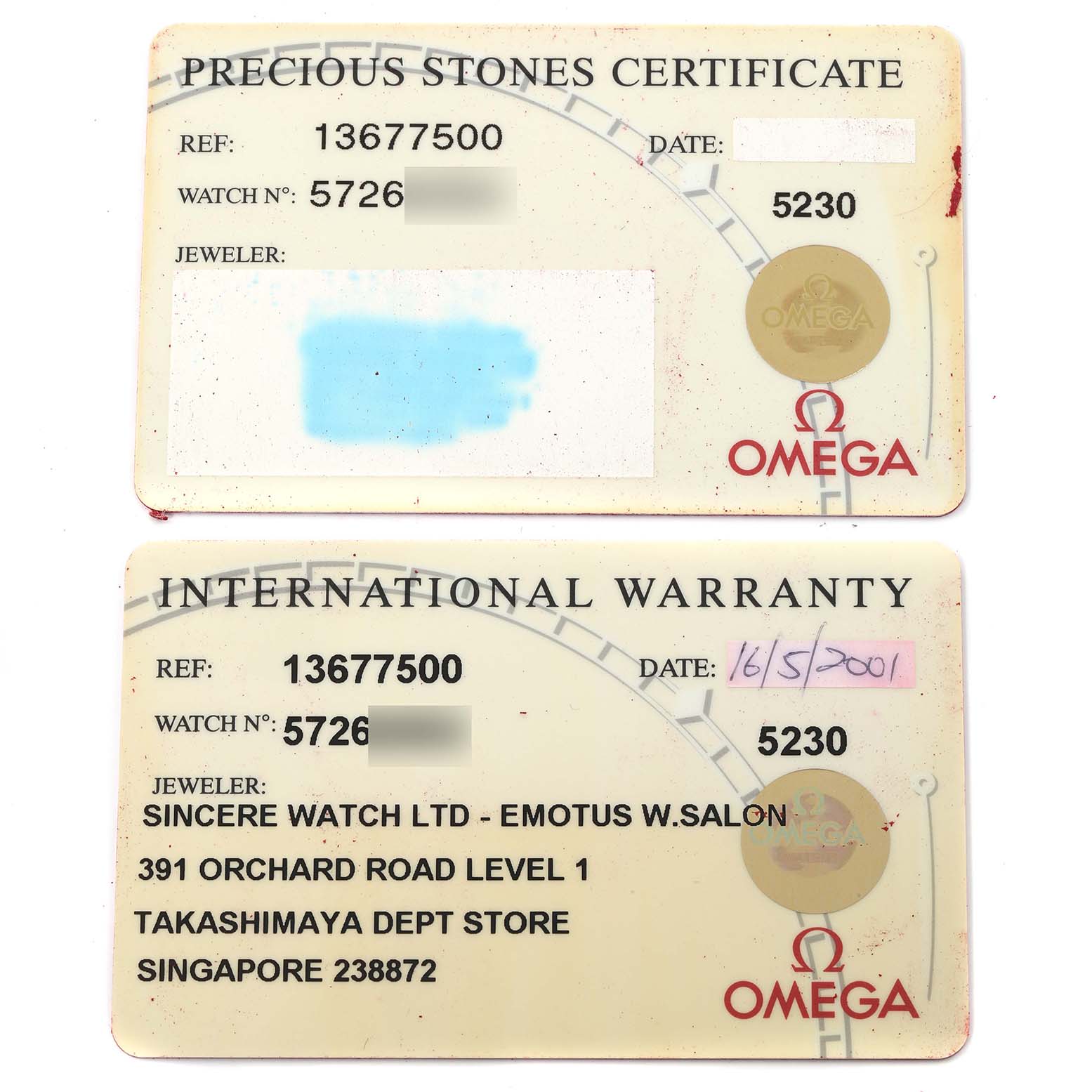 The image shows the Precious Stones Certificate and International Warranty cards for the Omega 1367.75.00 Women's Steel and Gold (two tone) Mother of Pearl Dial 1367.75.00 Women's Steel and Gold (two tone) Mother of Pearl Dial Constellation Steel Yellow Gold Diamond Ladies 1367.75.00.
