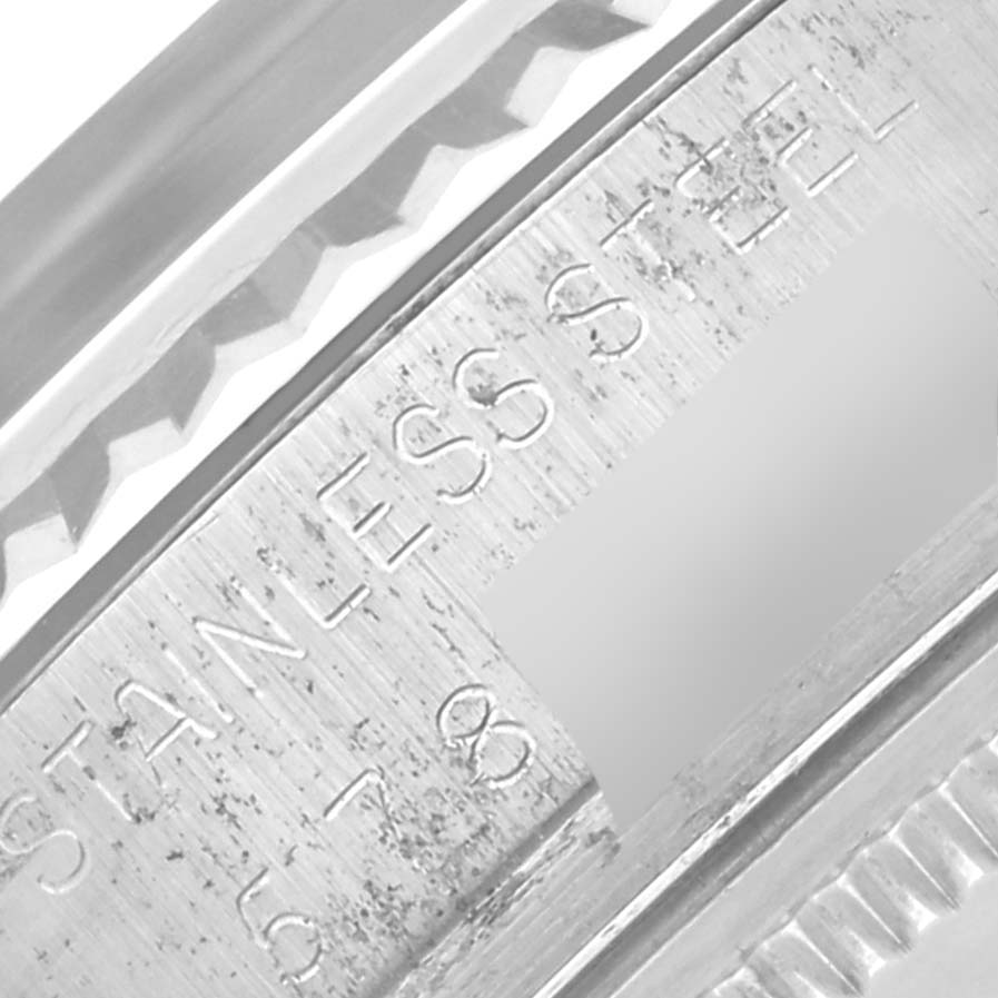 The image shows a close-up side angle of the Rolex Datejust 16014 Men's Stainless Steel Silver Dial 16014 Men's Stainless Steel Silver Dial model, highlighting part of the case and engraved details.