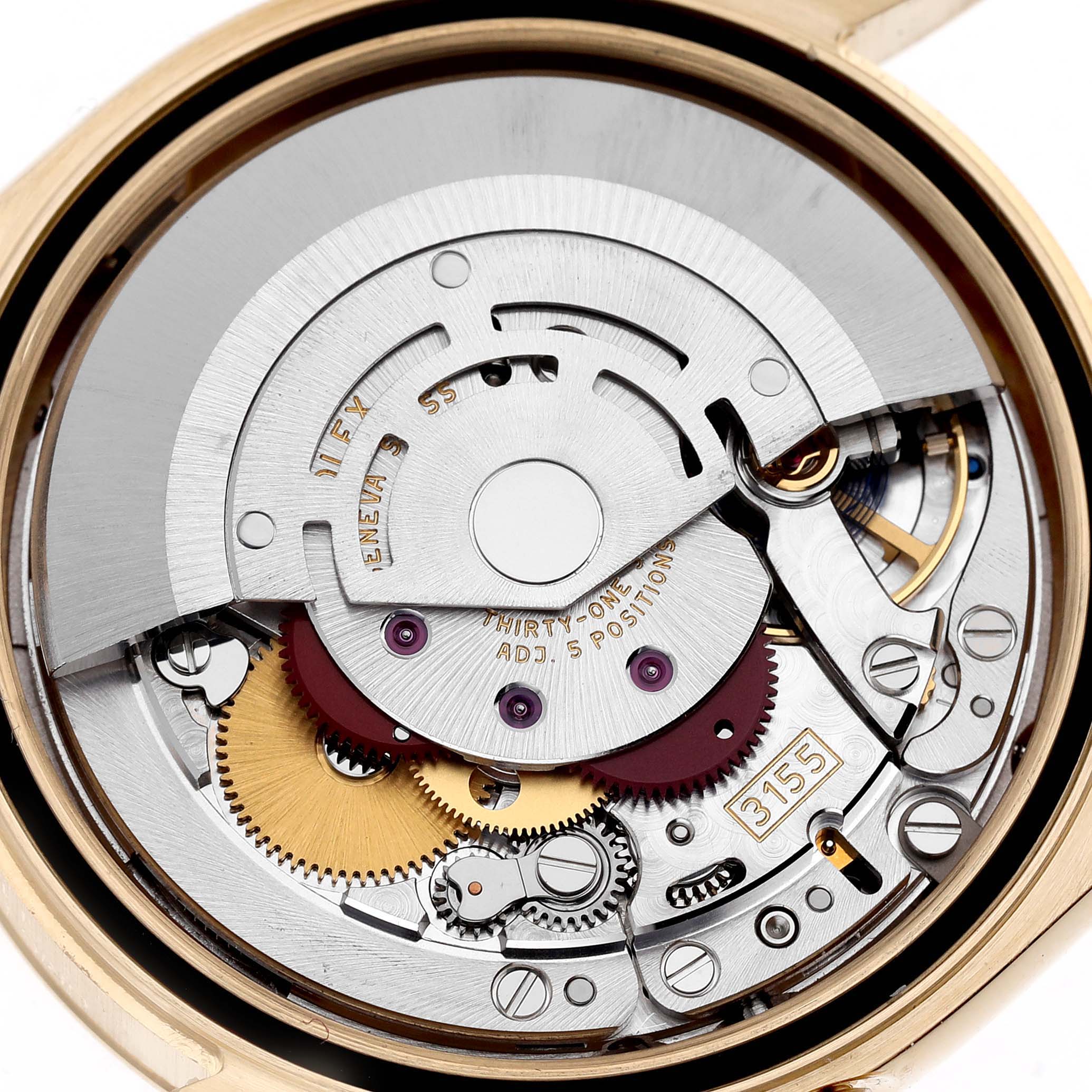 The image shows the internal movement of a Rolex President 118238 Men's Yellow Gold Green Dial 118238 Men's Yellow Gold Green Dial watch from a close-up top view, detailing gears and components.