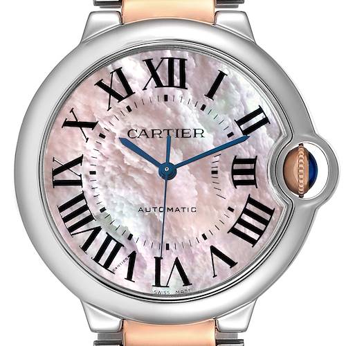The image shows a close-up of the dial and crown of a Cartier Ballon Bleu W6920033 Women's Steel and Gold (two tone) Mother of Pearl Dial W6920033 Women's Steel and Gold (two tone) Mother of Pearl Dial watch.