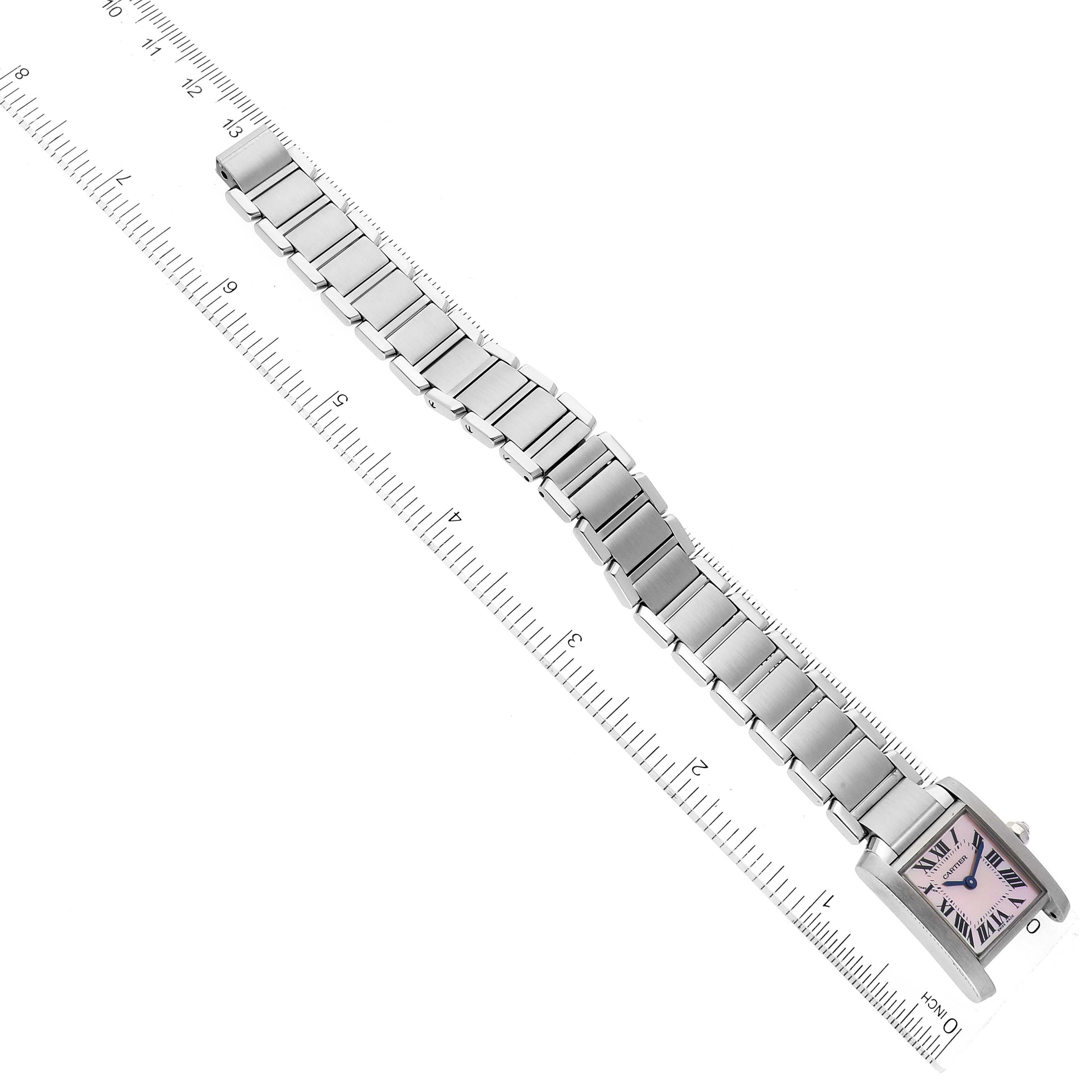 The image shows a Cartier Tank Francaise W51028Q3 Women's Stainless Steel Mother of Pearl Dial W51028Q3 Women's Stainless Steel Mother of Pearl Dial watch laid flat with a metal link bracelet, next to a ruler.
